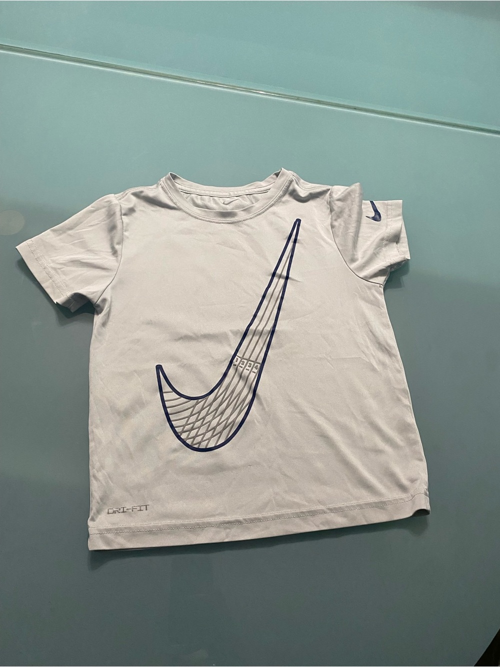 Nike gray Kids Short Sleeve Tee with Navy Swoosh Graphic